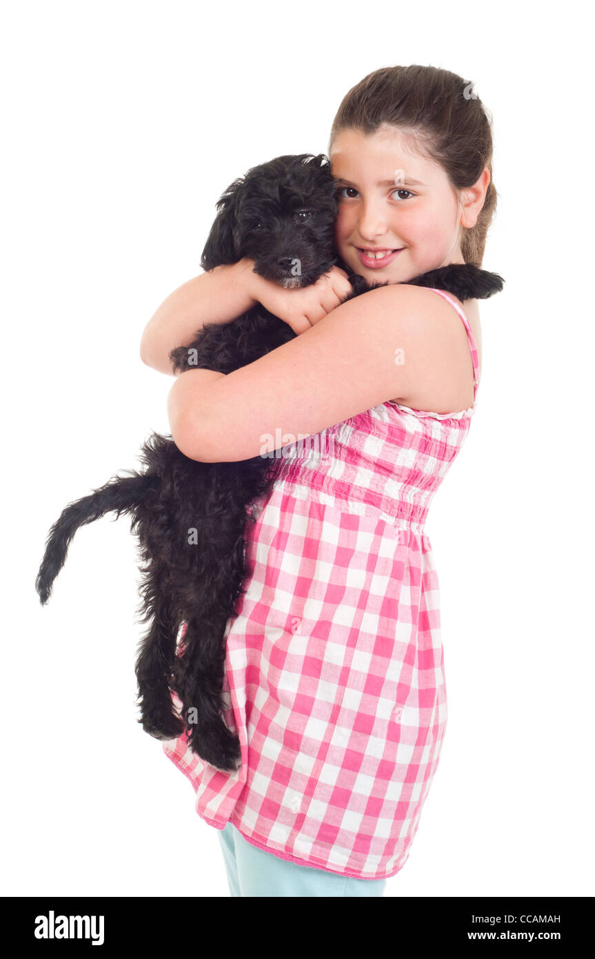 Little girl holding her dog Stock Photo - Alamy