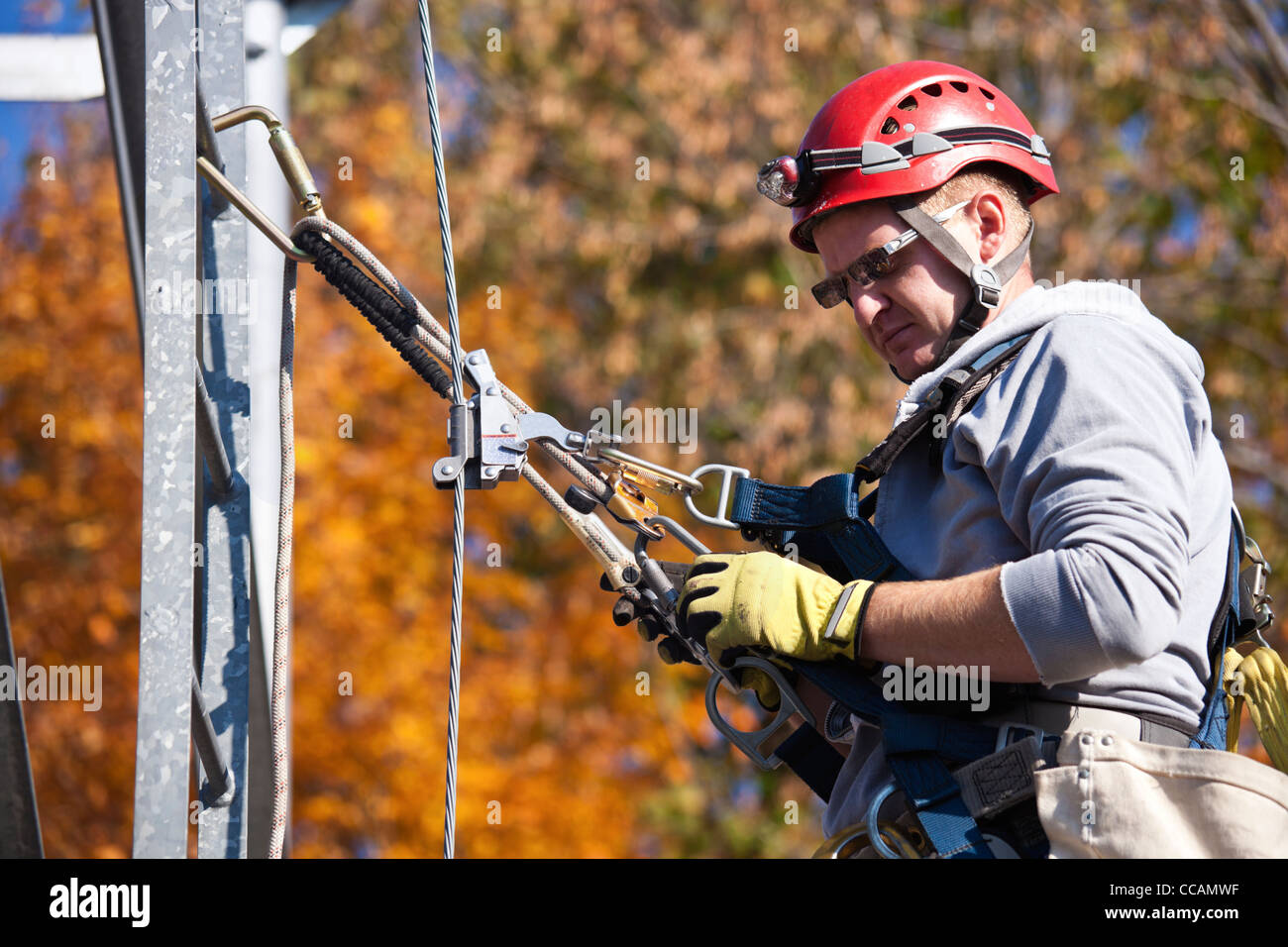 Telecom tower climber working on top of radio tower installing a amateur  radio shortwave directional antenna Stock Photo - Alamy