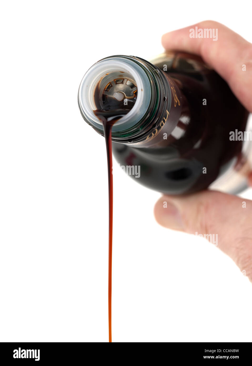 Pouring out a measure of Aceto Balsamico vinegar Stock Photo