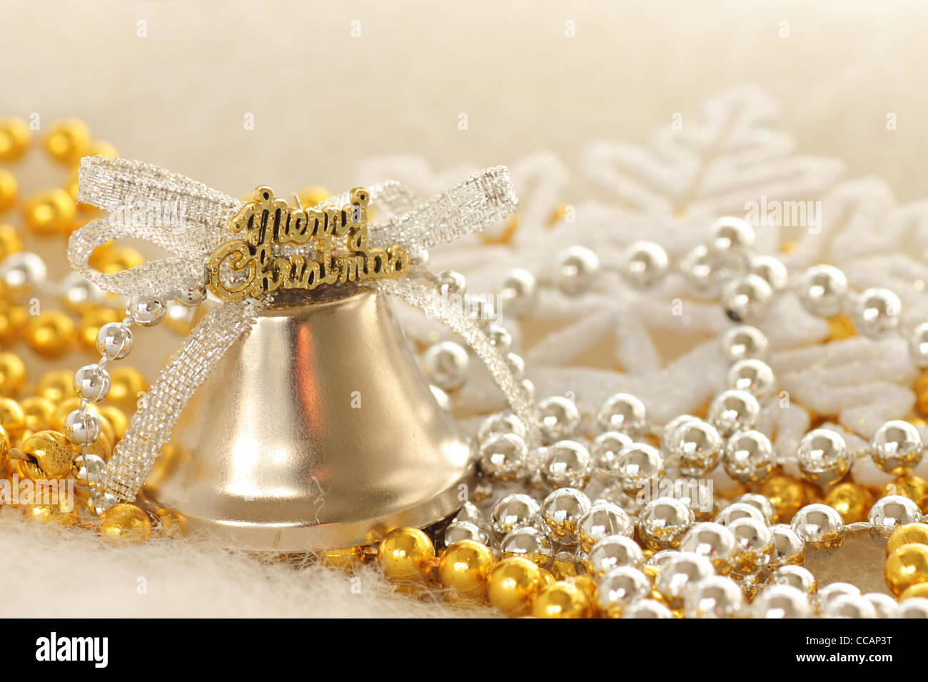 christmas tree decorations: merry christmas bell on beads Stock Photo