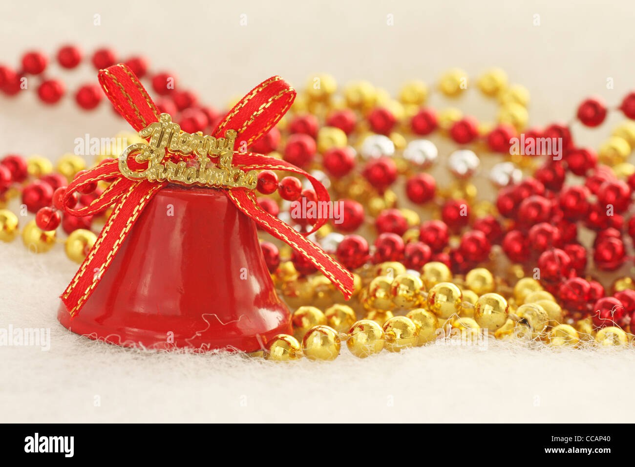 merry christmas bell near beads Stock Photo