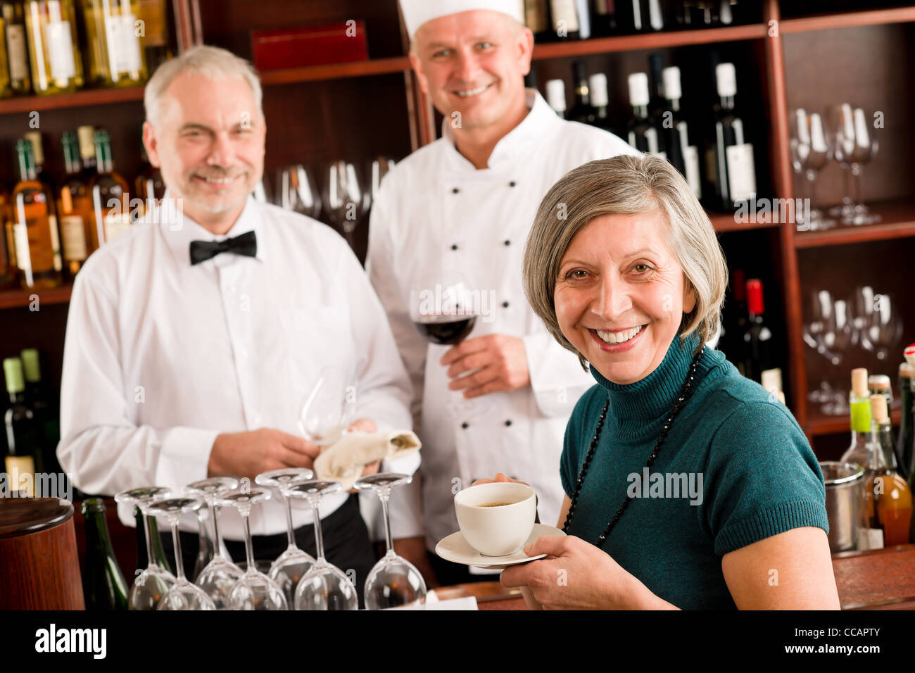 Restaurant smiling manager have break with staff wine bar Stock Photo