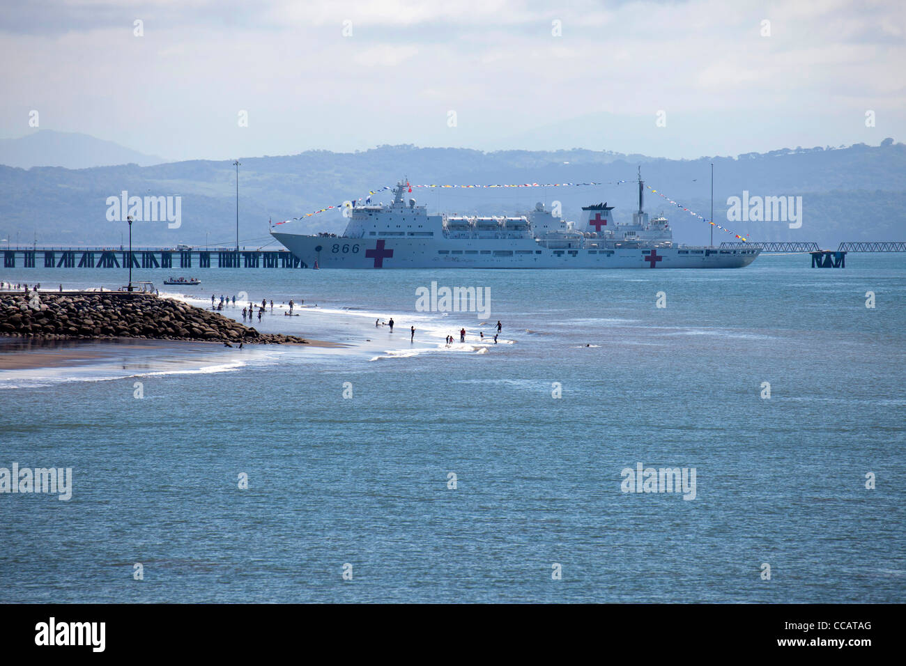 tourists and a Hospital ship at the beach in Puntarenas, Costa Rica, Central America  Stock Photo