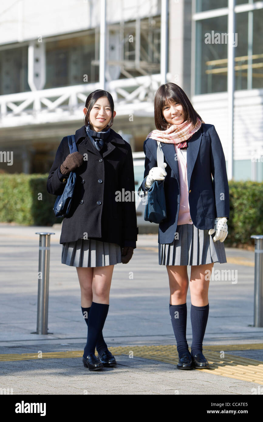 Two high school girls in the street Stock Photo