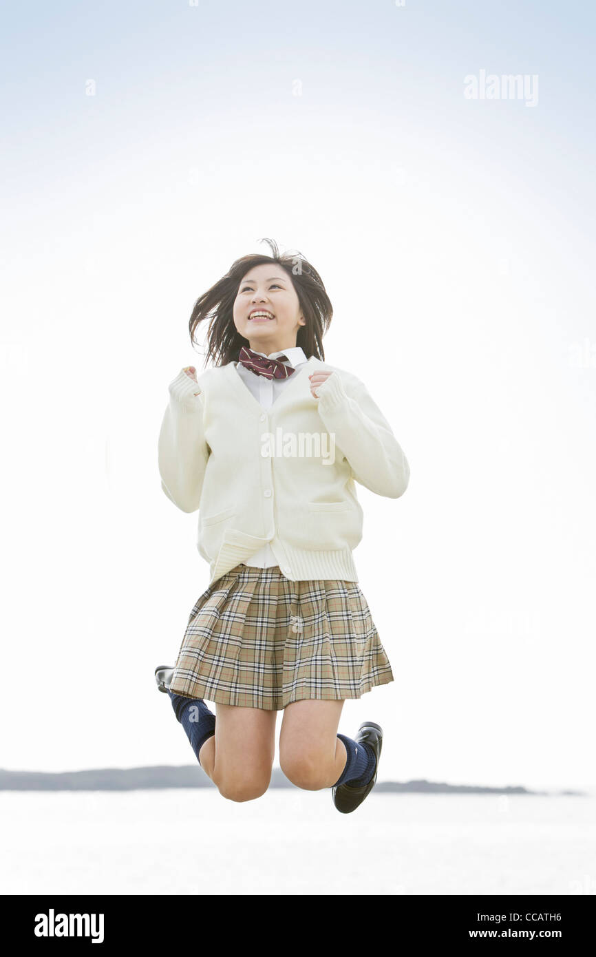 High school girl jumping Stock Photo