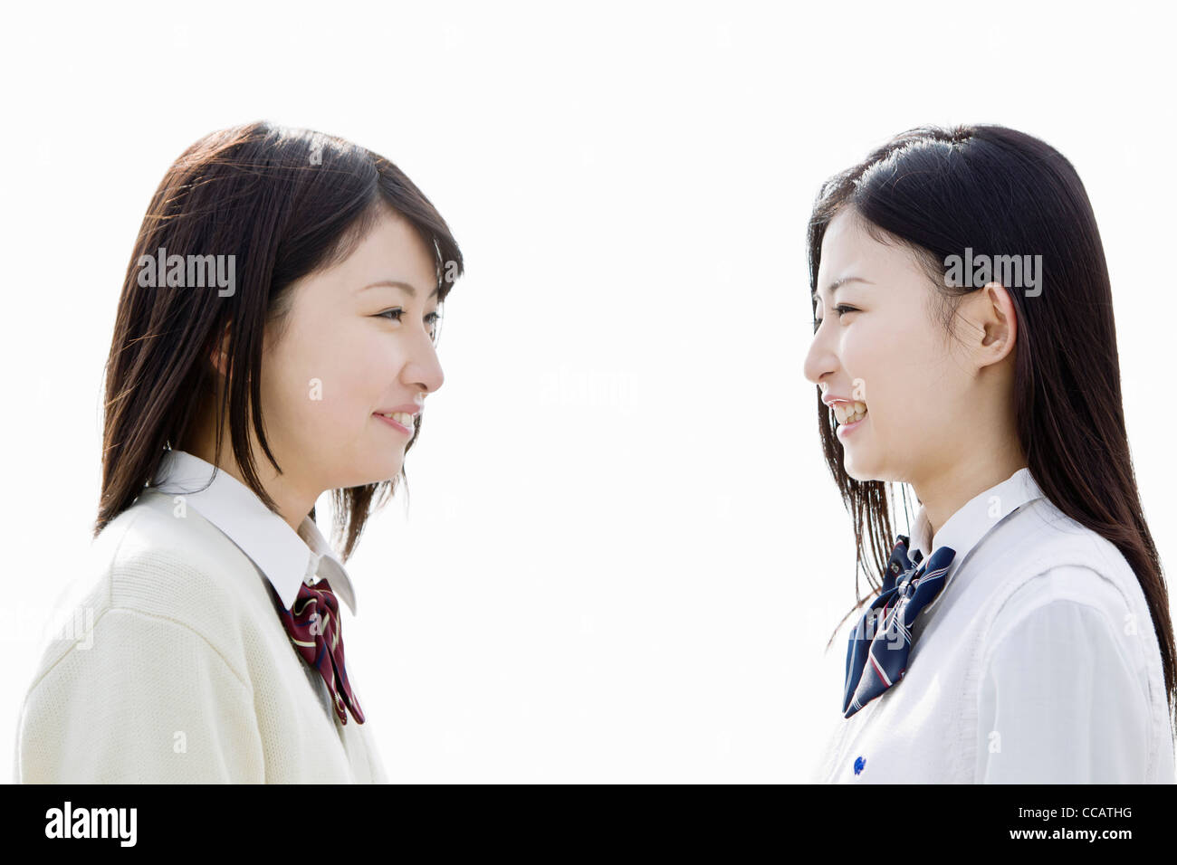 Two high school girls looking at each other Stock Photo