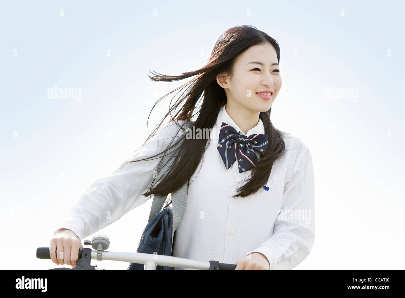 High school girl and a bicycle Stock Photo