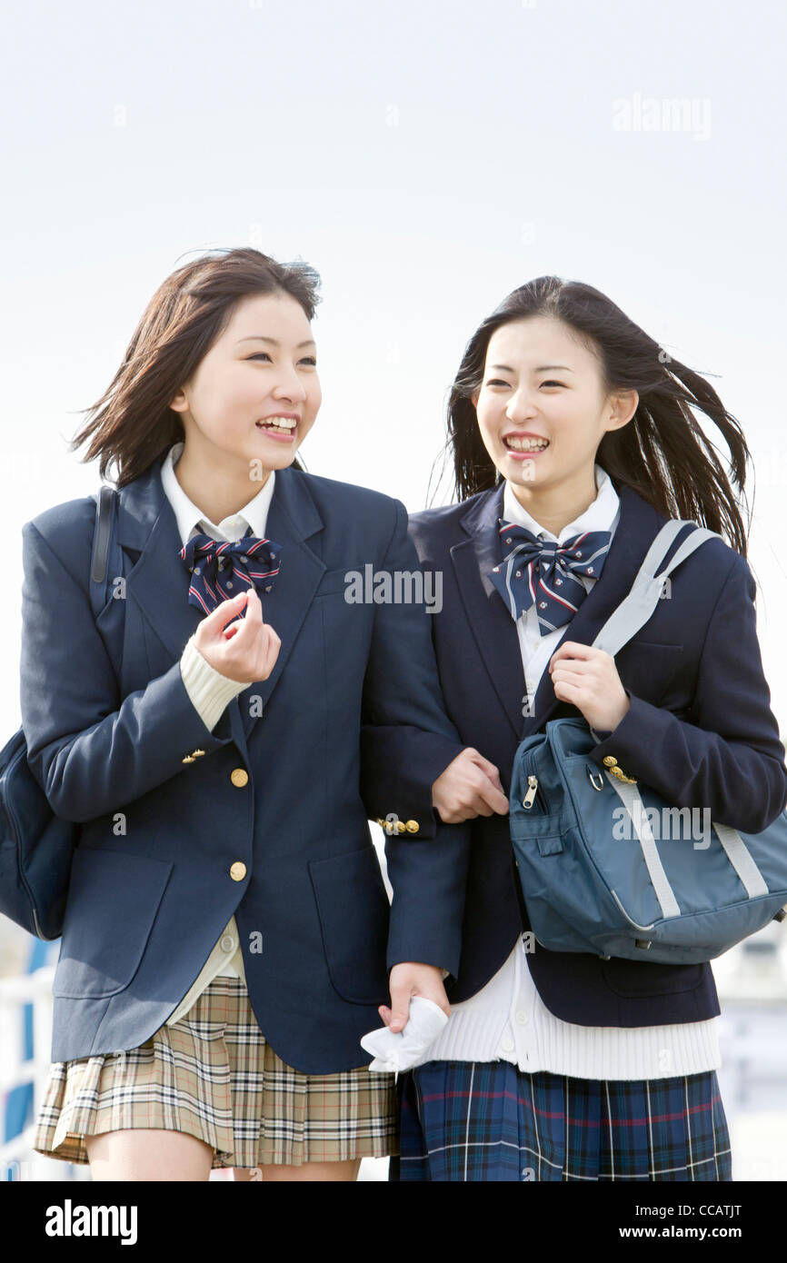 Two high school girls walking Stock Photo