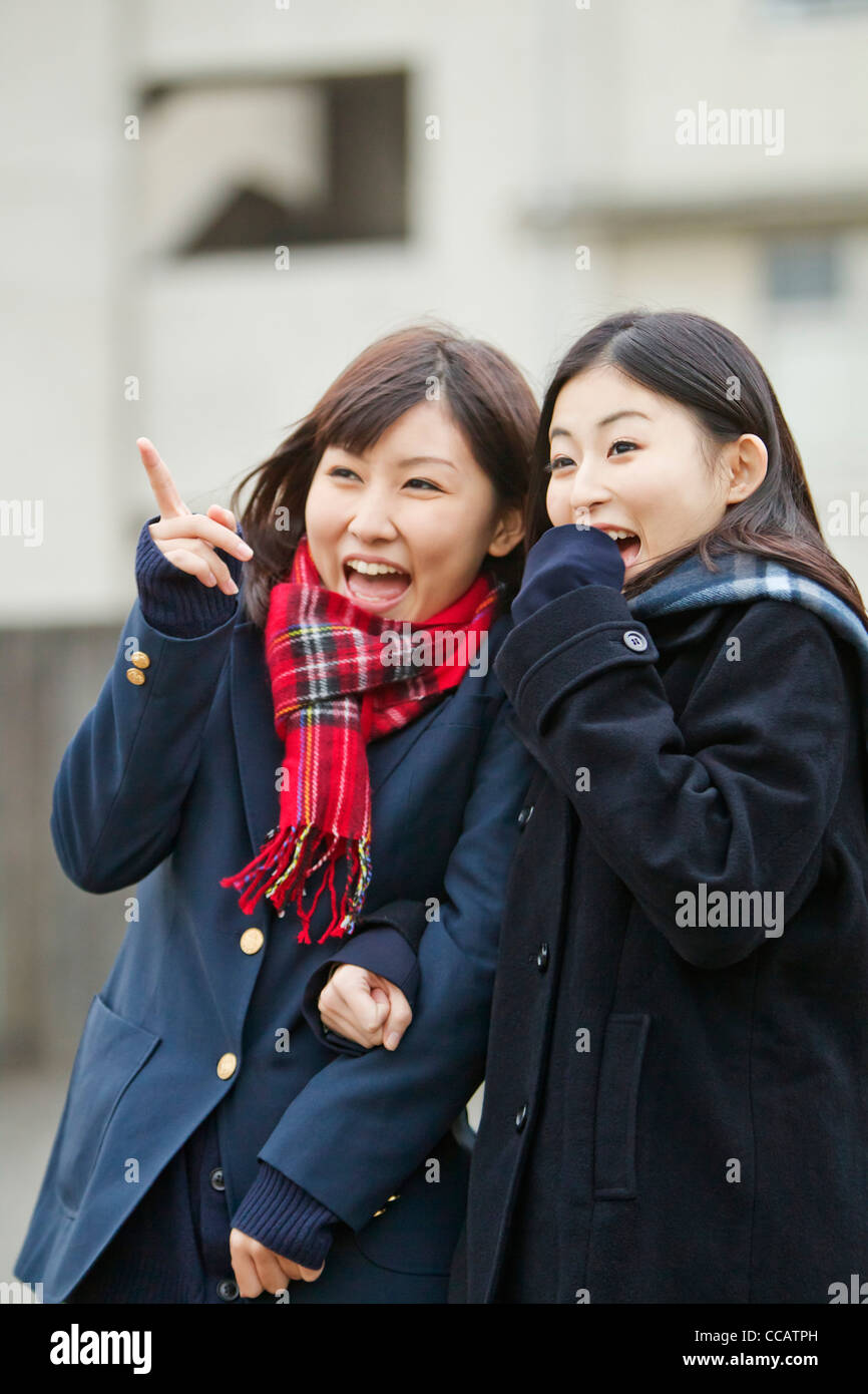 Two high school girls laughing Stock Photo - Alamy