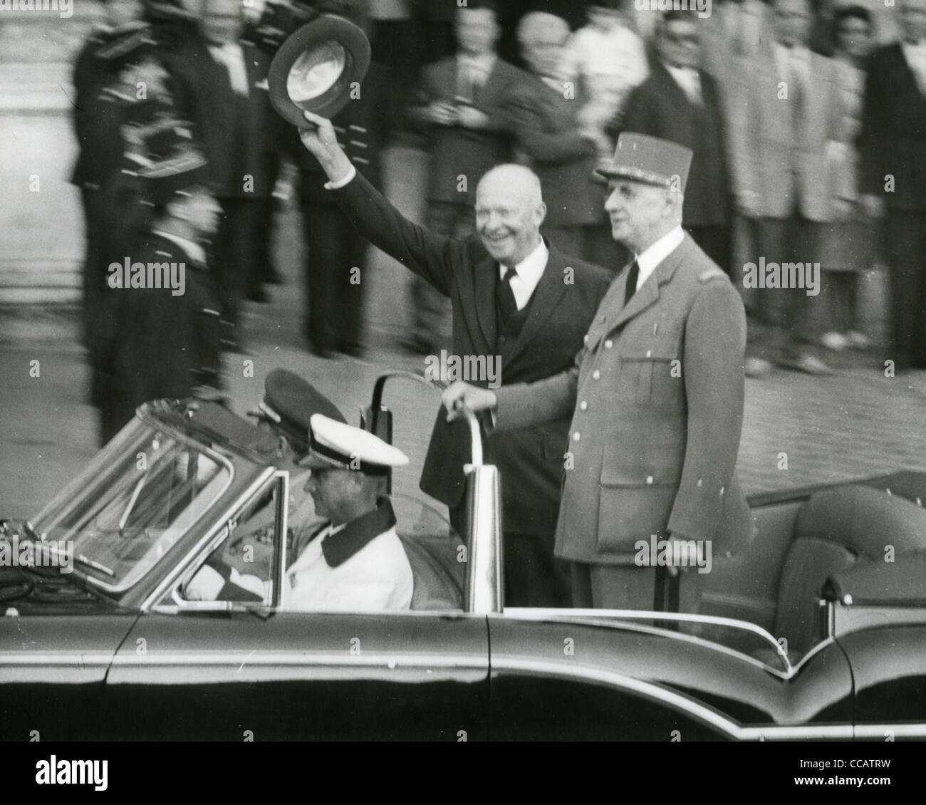 US PRESIDENT DWIGHT D. EISENHOWER waIves to crowd on visit to Paris with President Charles De Gaulle in 1960 Stock Photo