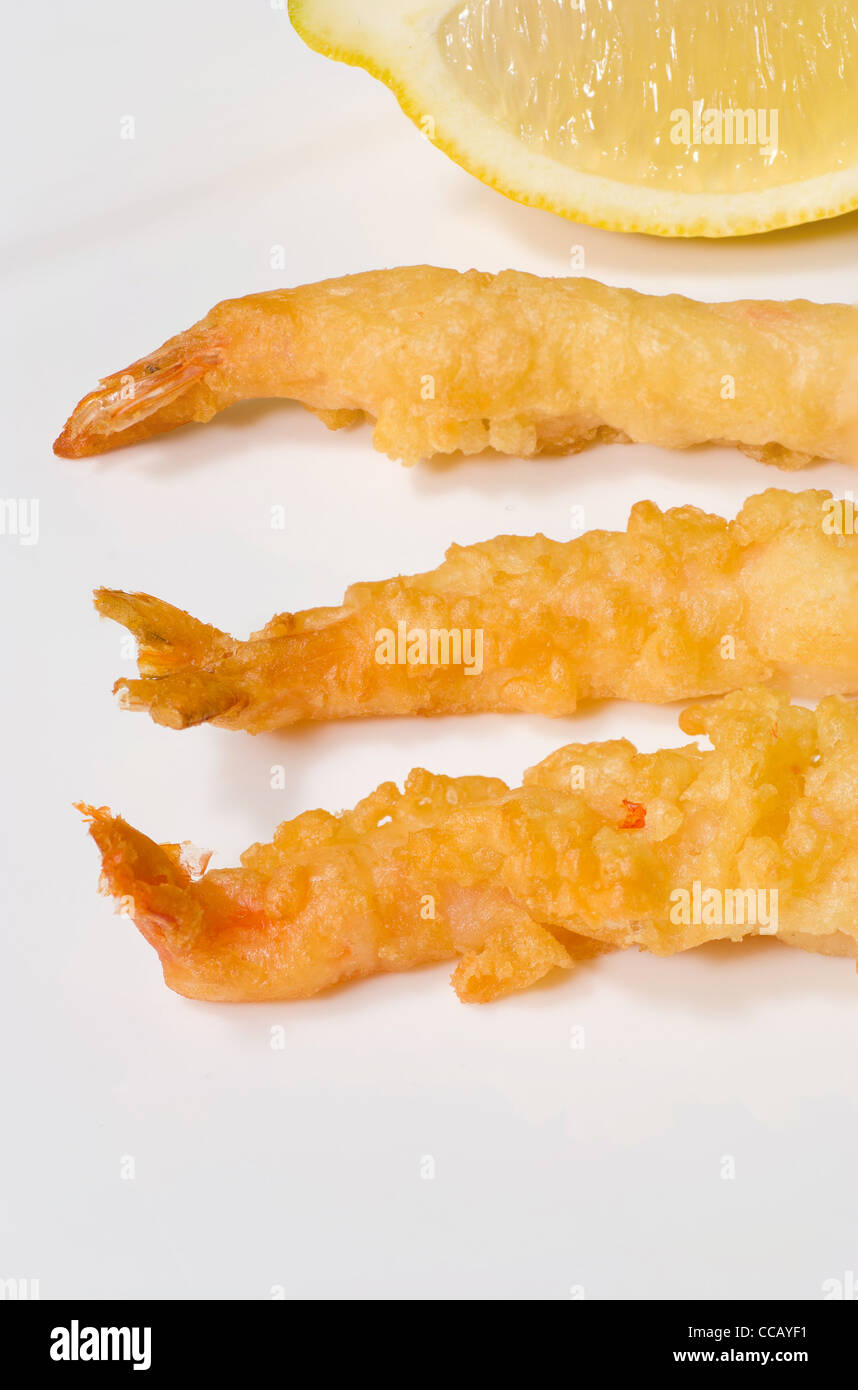 Tempura battered prawns on a white plate Stock Photo Alamy