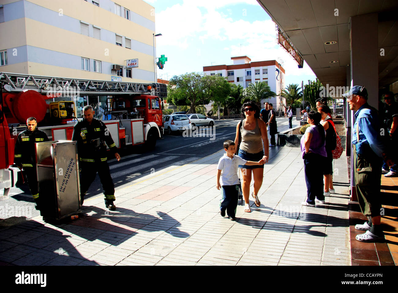 People watching firemen at work in San Fernando de Maspalomas, Gran Canaria Stock Photo