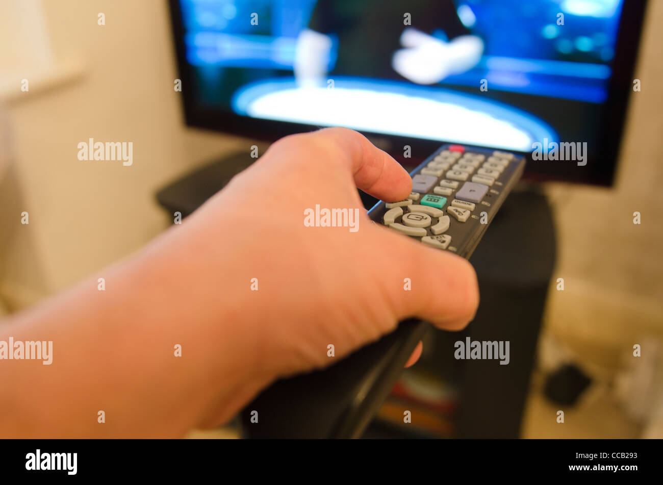 Using the tv remote control. Picture by Pete Gawlik Stock Photo Alamy