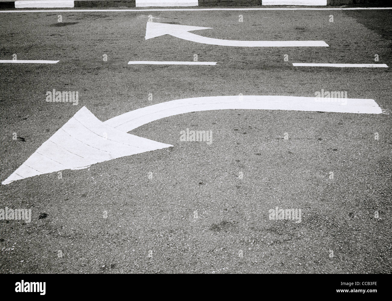 Road markings in Melaka in Malaysia in Far East Southeast Asia. Direction Arrow Divergence Street Scene Surreal Surrealism Travel Diverging Breaking Stock Photo