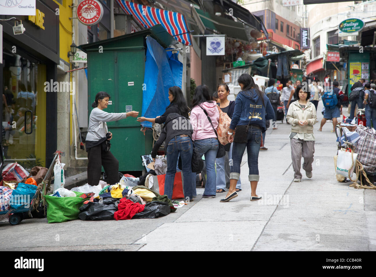 asian women buying clothes from a street stall on the ground on the sloping elgin street hong kong hksar china asia Stock Photo