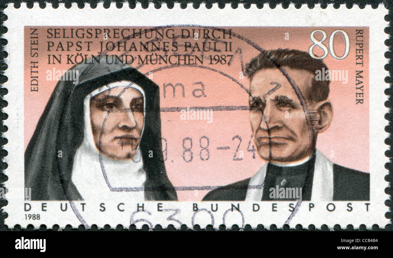 A stamp printed in Germany, shows the Beatification of Edith Stein and Rupert Mayer by Pope John Paul II in 1987, circa 1988 Stock Photo