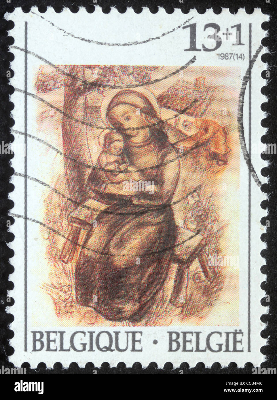 A greeting Christmas stamp printed in Belgium shows Madonna and Child, 1987 Stock Photo