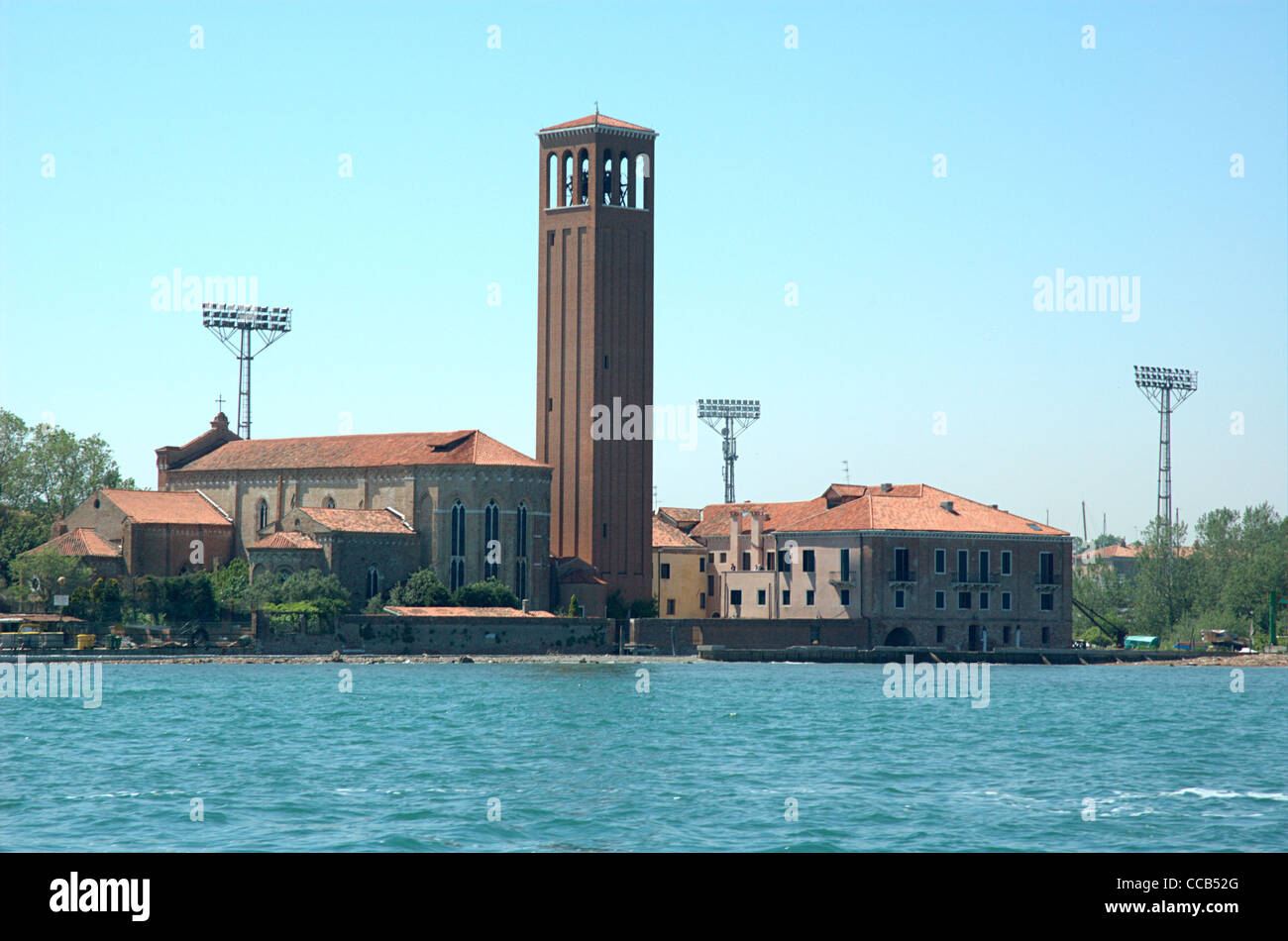 Chiesa di Sant'Elena Venezia or Church of Sant'Elena, Venice, with the floodlights of the football stadium in the background. Stock Photo