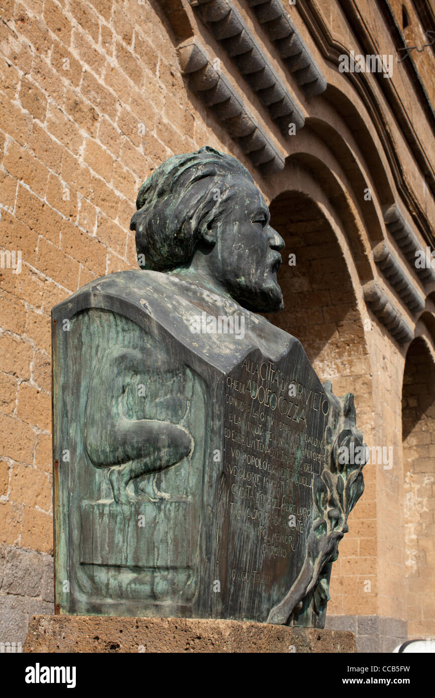 The bust of Adolfo Cozza below the Palazzo del Popolo, Italy. Stock Photo