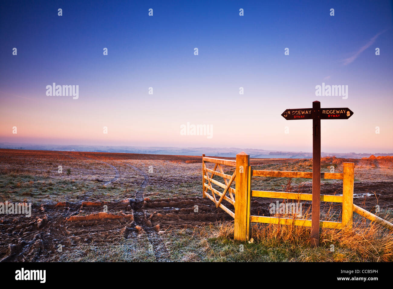 A frosty winter sunrise over the Ridgeway long distance path at Hackpen Hill, Wiltshire, England, UK Stock Photo