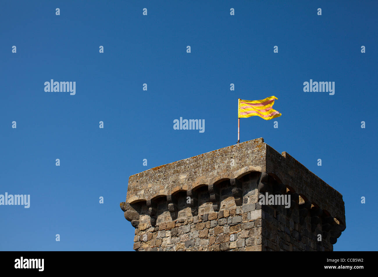 The Bolsena flag flying above the town castle, Italy. Stock Photo