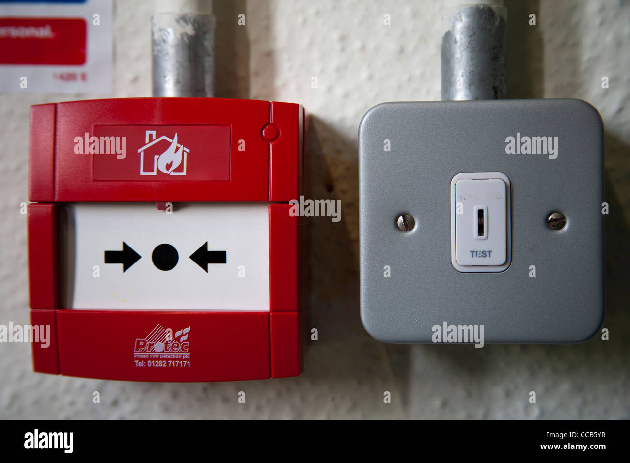 Fire alarm callpoint and emergency light test switch Stock Photo - Alamy