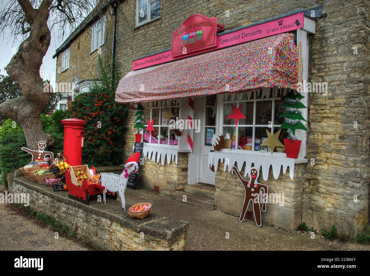The village shop in Yardley Hastings decked out with an array of Christmas decorations. Stock Photo