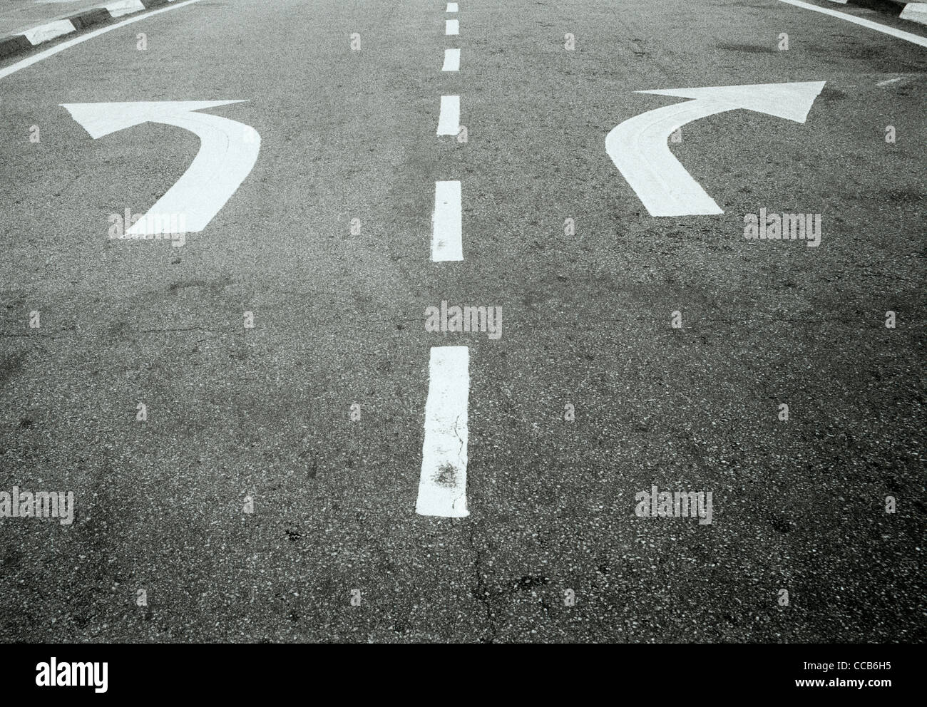 Road markings in Melaka in Malaysia in Far East Southeast Asia. Direction Arrow Divergence Street Scene Surreal Surrealism Travel Stock Photo