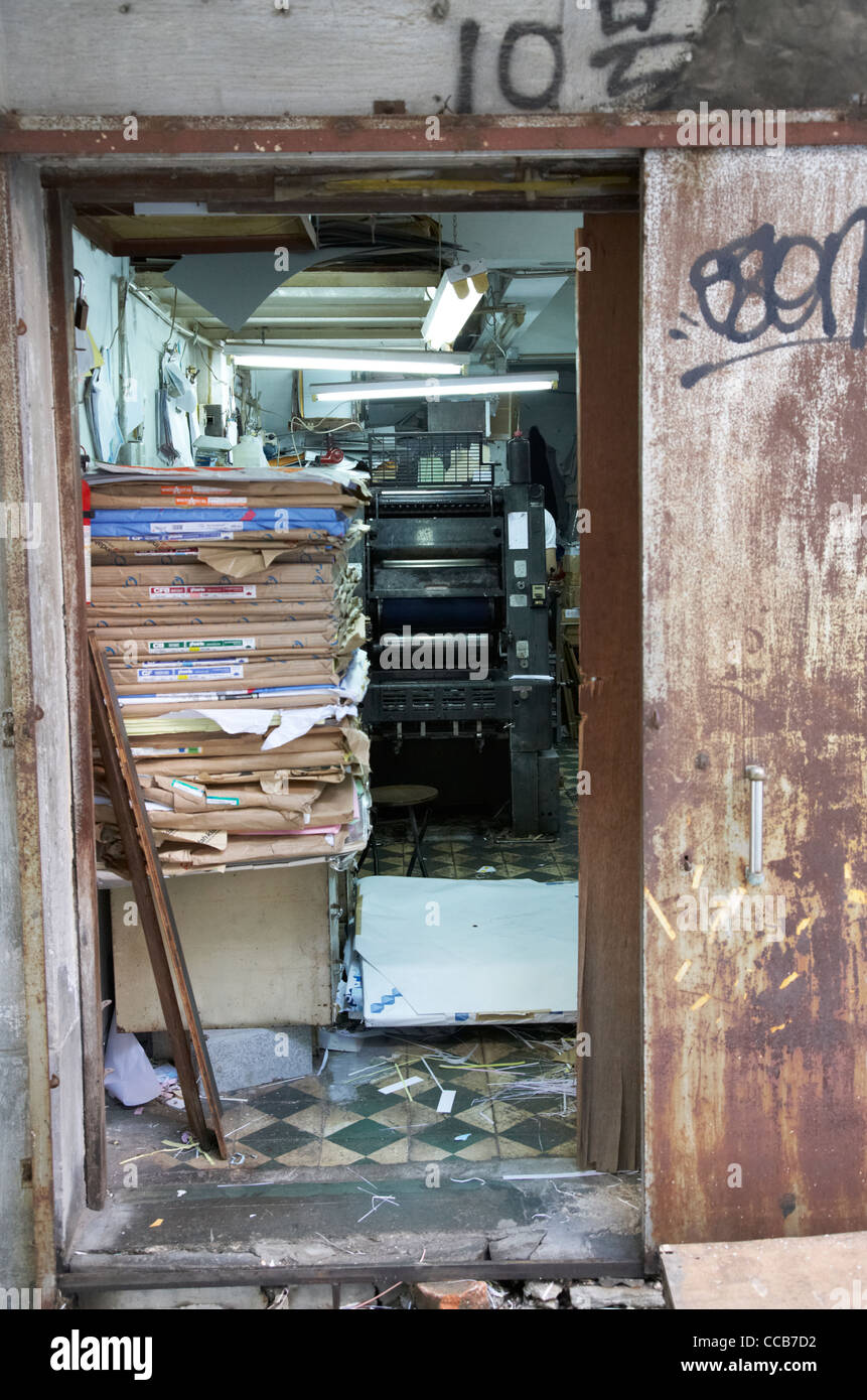 entrance door to old chinese printers shop including printing press and