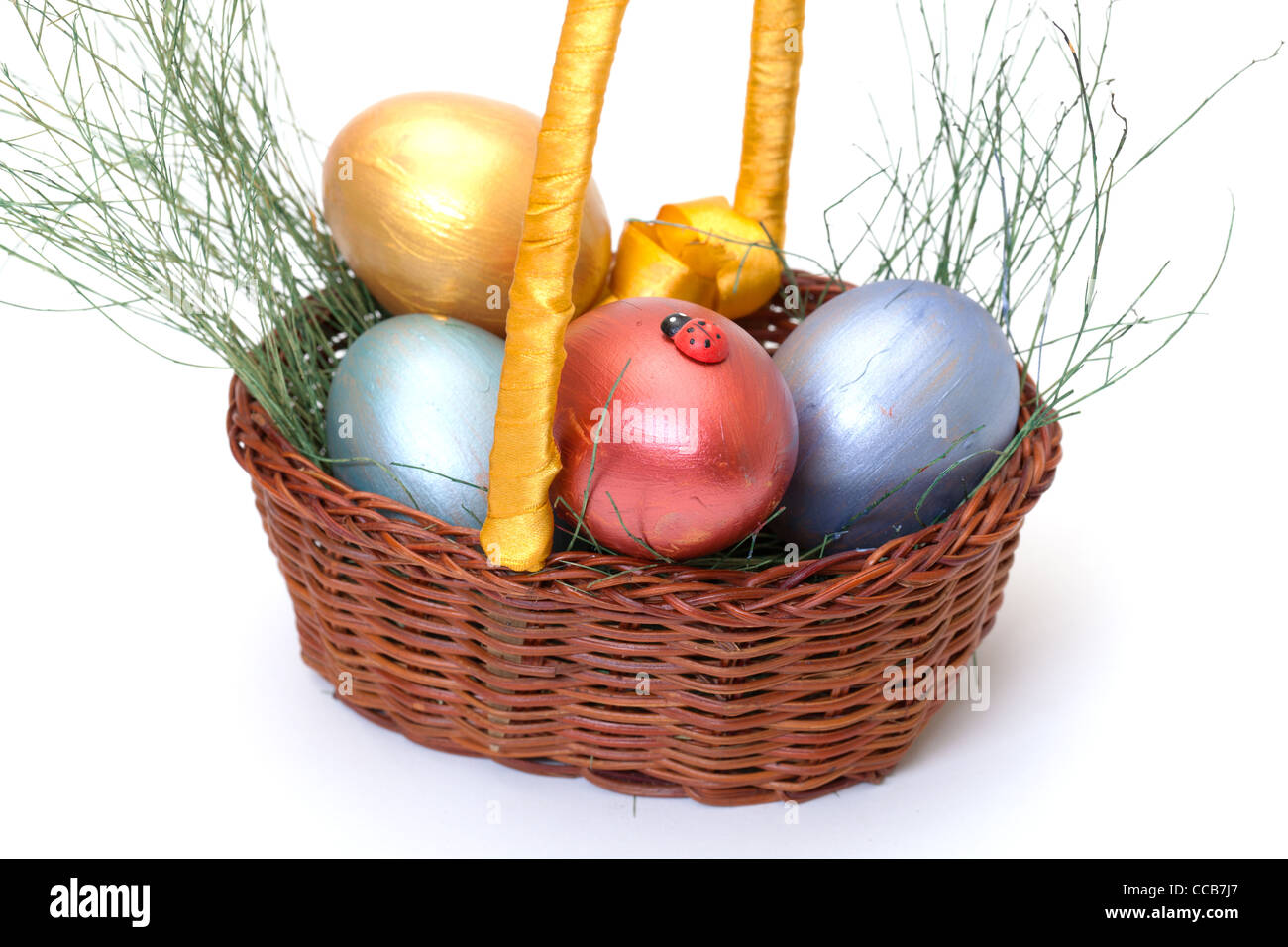 Colorful painted easter eggs in basket on white Stock Photo - Alamy