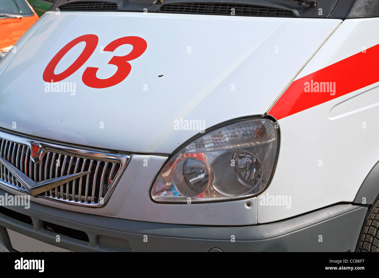 car to ambulance on road Stock Photo