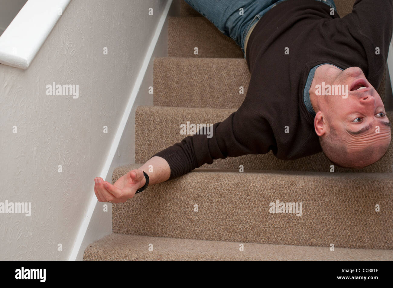 Man falling down stairs hi-res stock photography and images - Alamy