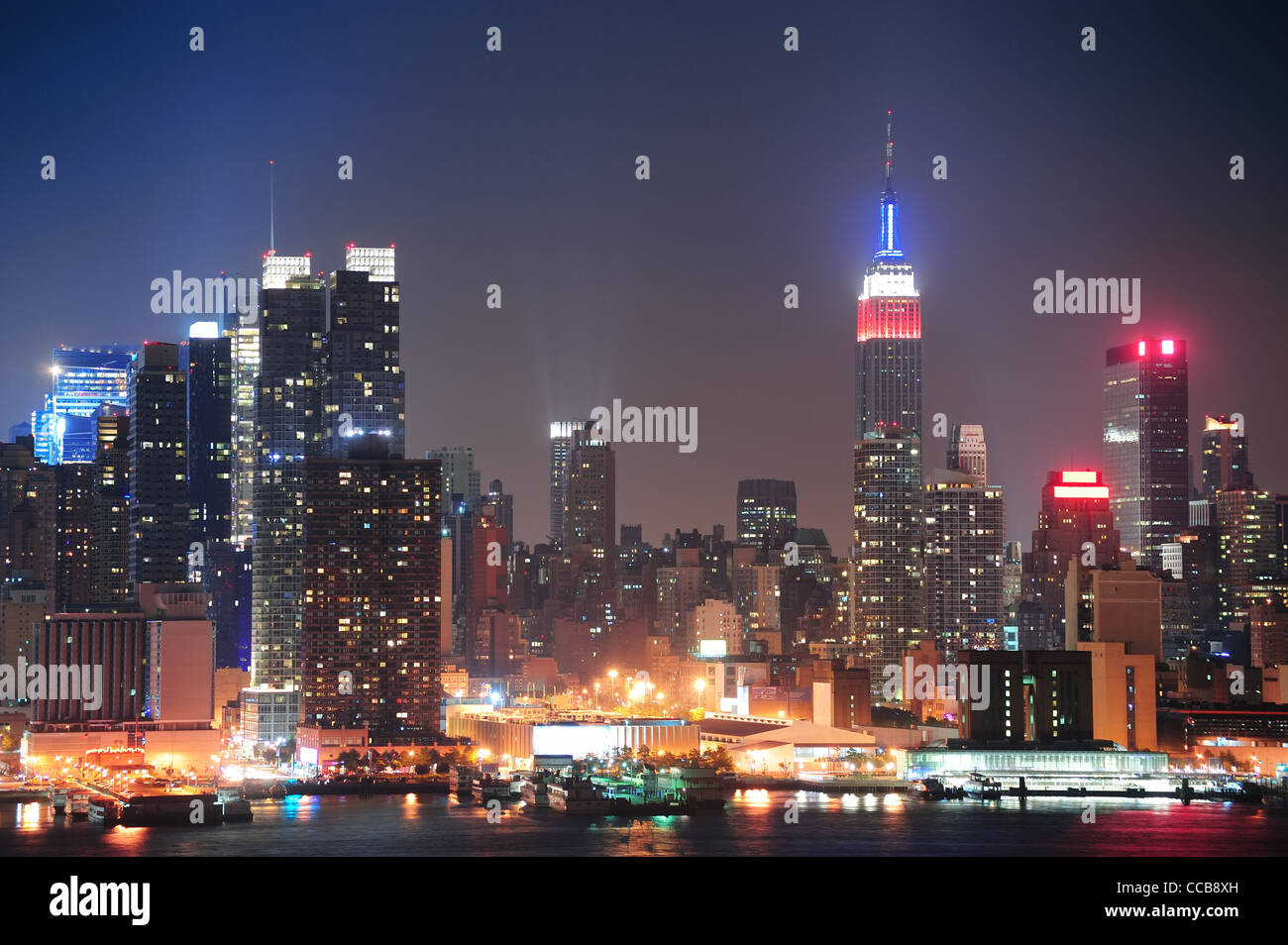 New York City Manhattan midtown skyline at night with skyscrapers lit ...