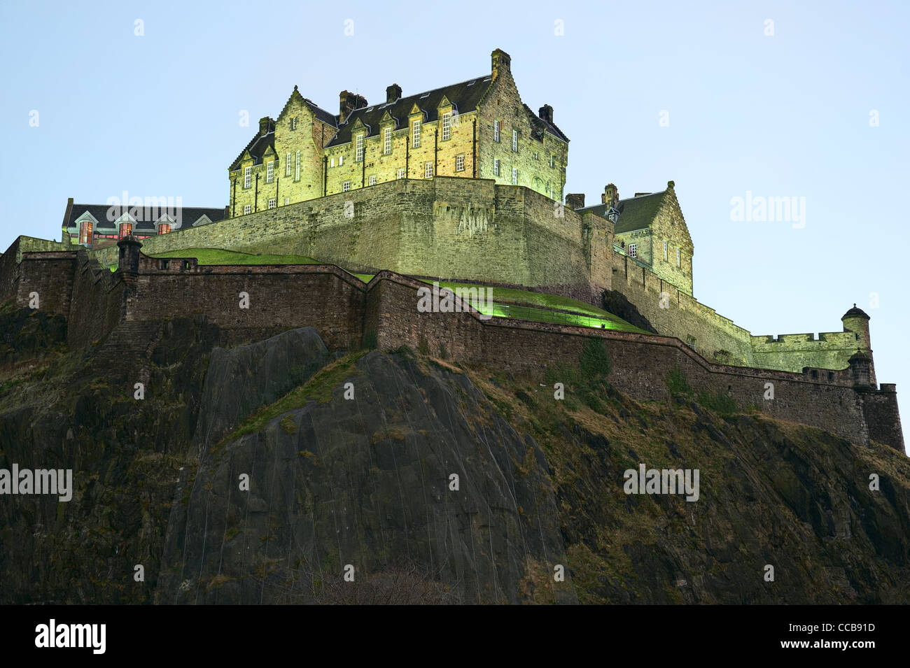 Edinburgh Castle, illuminated at nightfall, in winter from the north west. Stock Photo