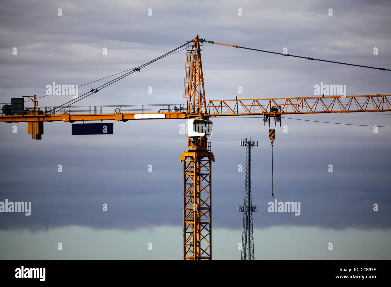 Construction tower crane with stormy sky in the back ground Stock