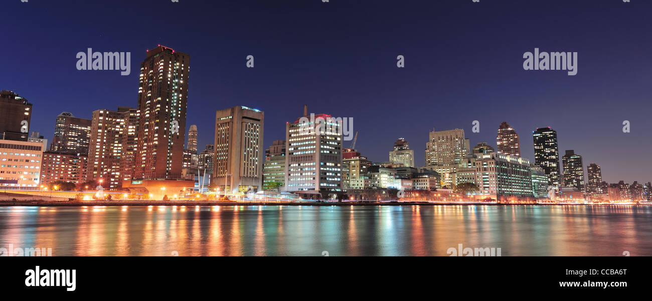New York City Manhattan midtown skyline at night over East River Stock ...