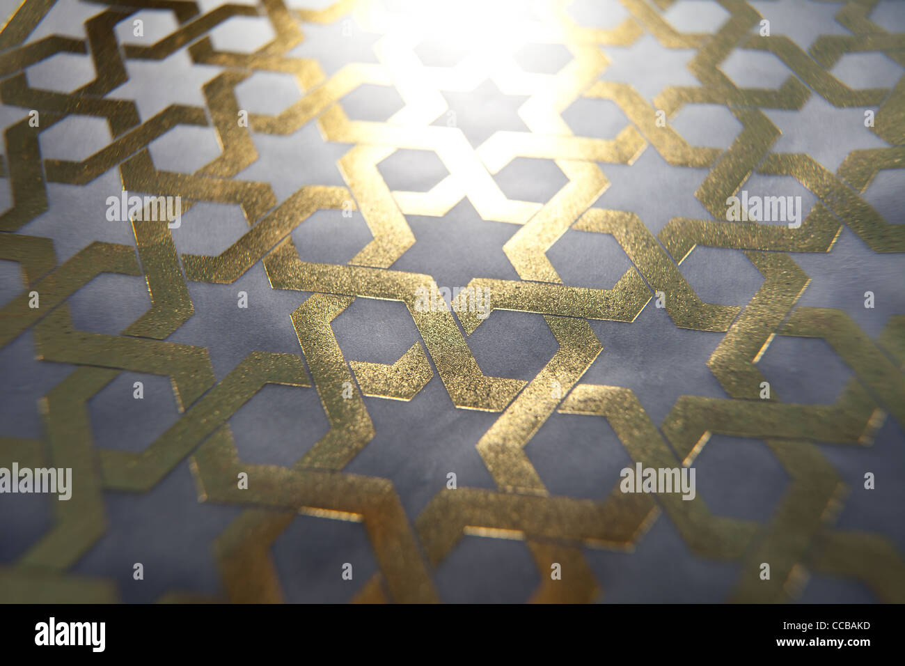 Islamic geometric pattern from Iran, Iranian Muslim pattern in gold leaf middle east, eastern history. Stock Photo