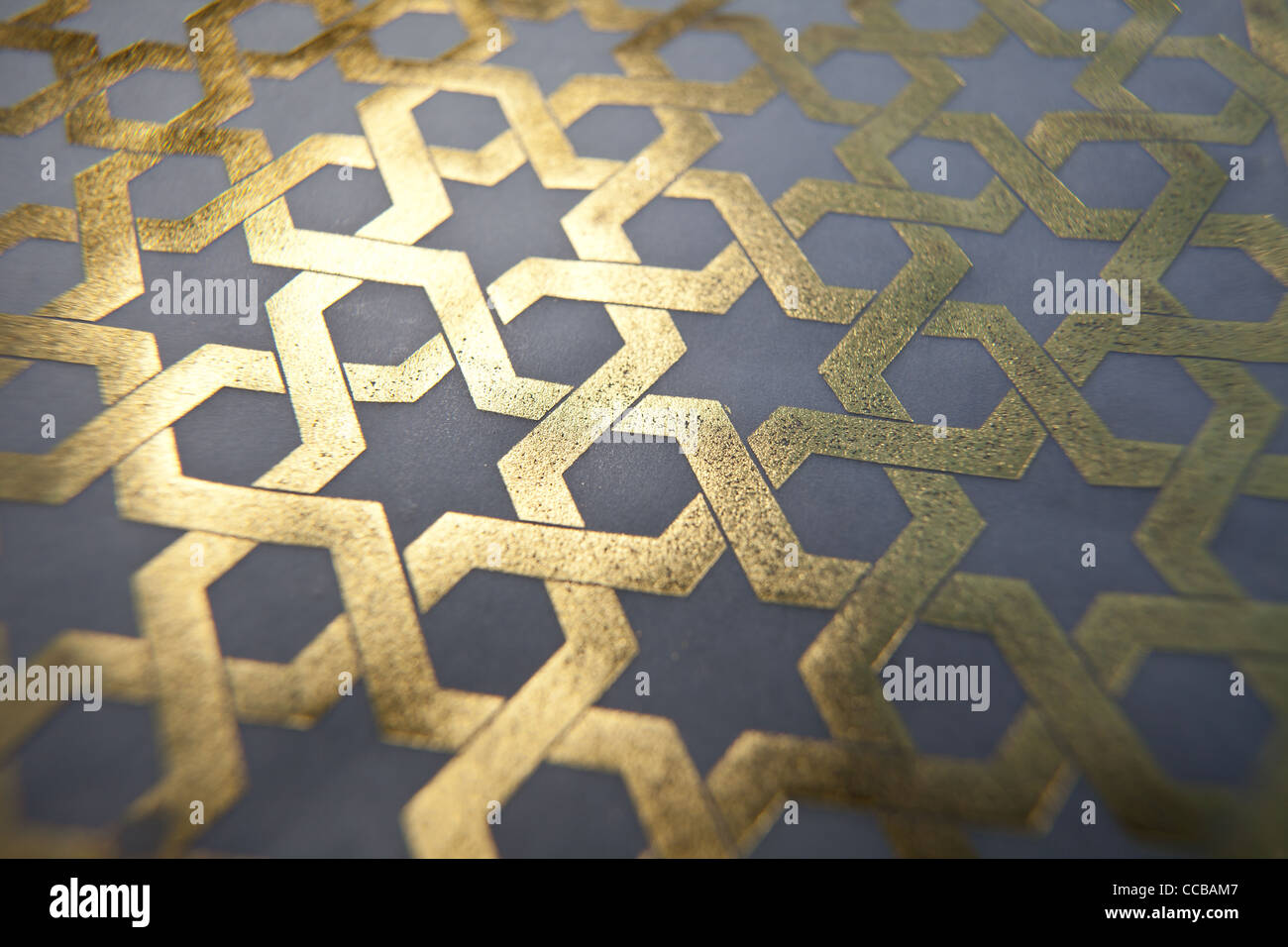 Islamic geometric pattern from Iran, Iranian Muslim pattern in gold leaf middle east, eastern history. Stock Photo