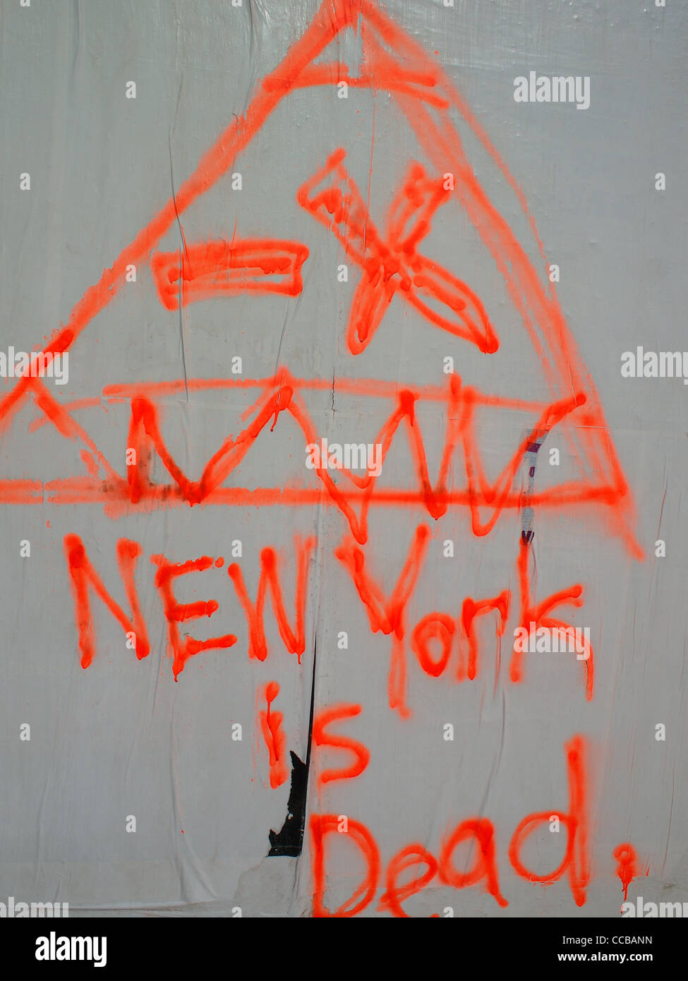 Graffito on wall -- 'New York is Dead.' Stock Photo