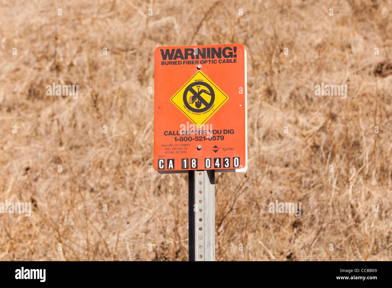 Buried fiber optic cable warning sign Stock Photo