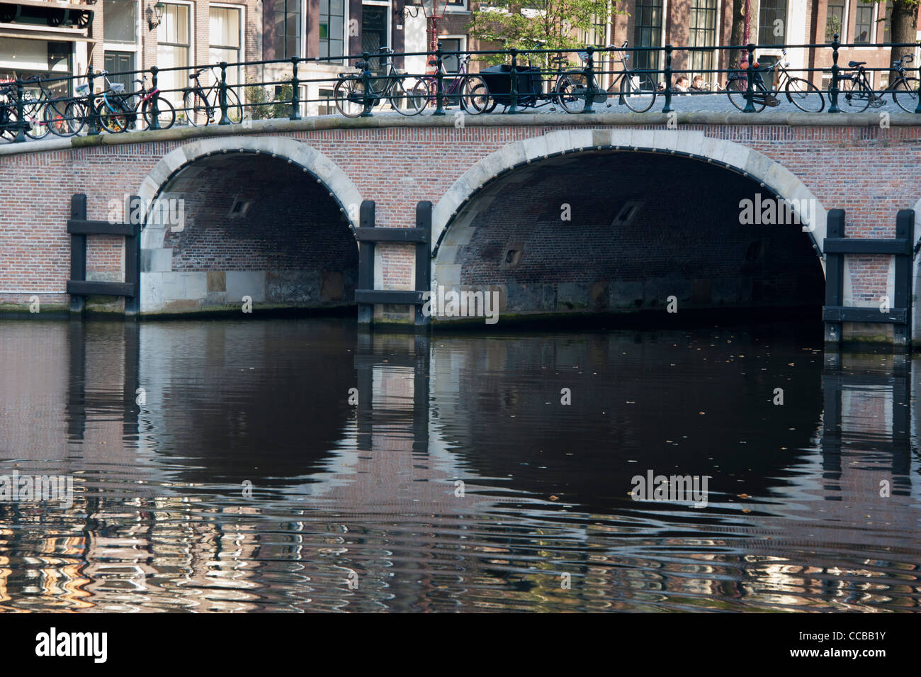 Reflection of a bridge in Amsterdam, The Netherlands. Stock Photo