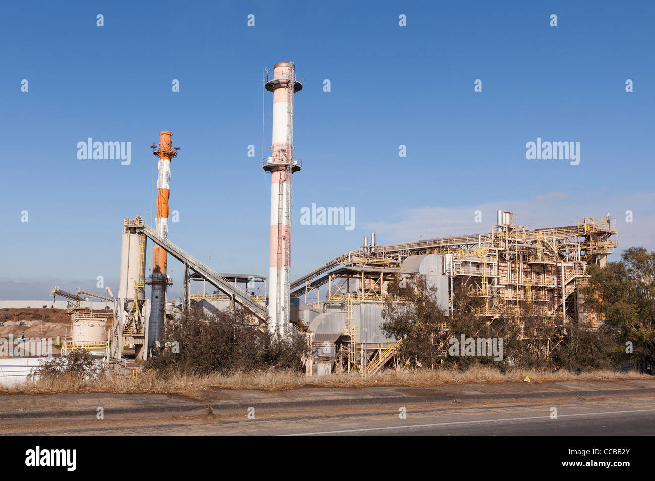 Processing plant smoke stacks Stock Photo