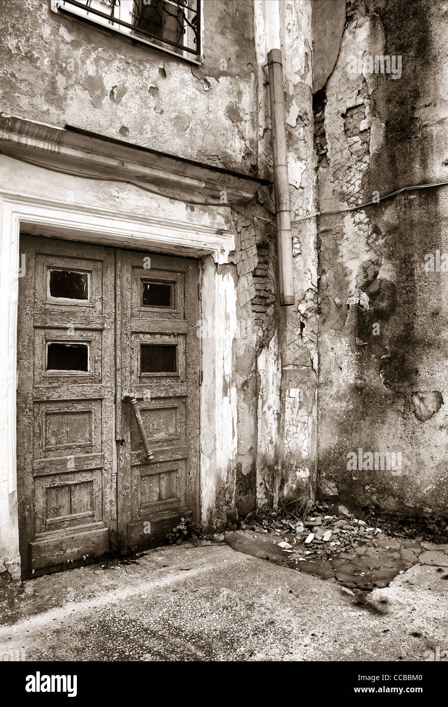 aging door in destroyed building Stock Photo