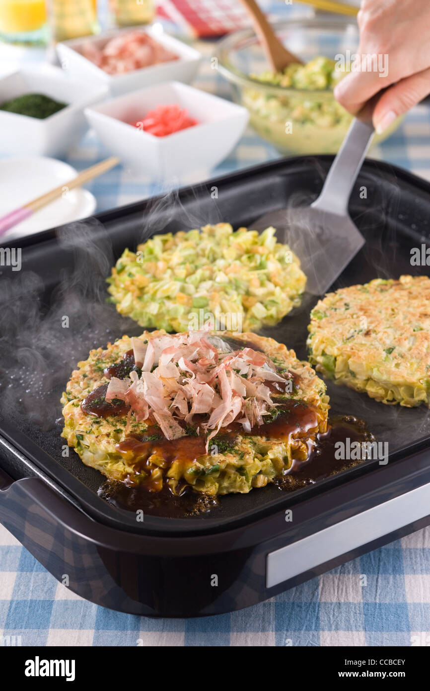 Okonomiyaki on Hot Plate Stock Photo