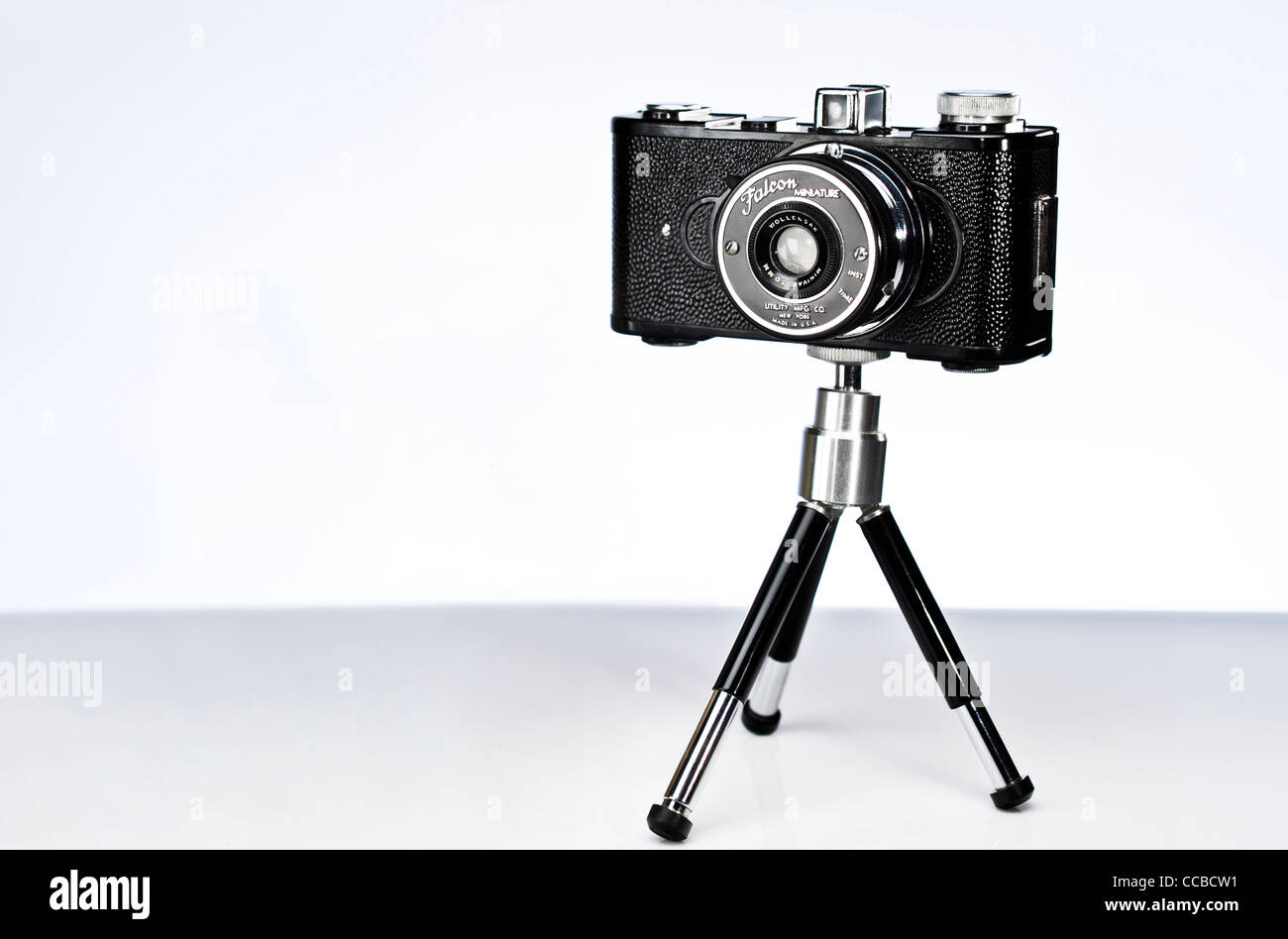 A vintage Falcon Miniature film camera on a mini tripod Stock Photo