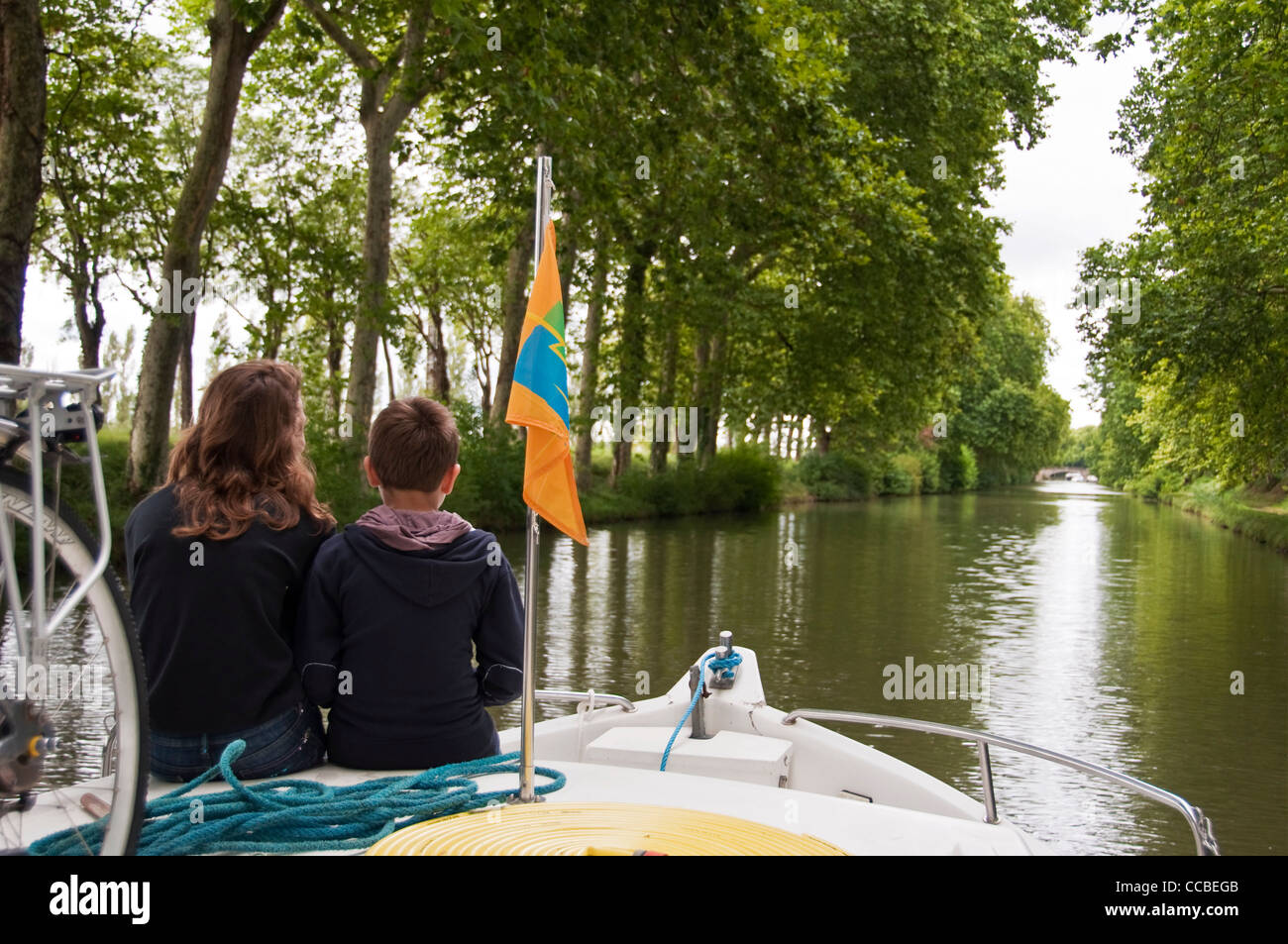 Two children on boat on the Canal du Midi - Southern France Stock Photo