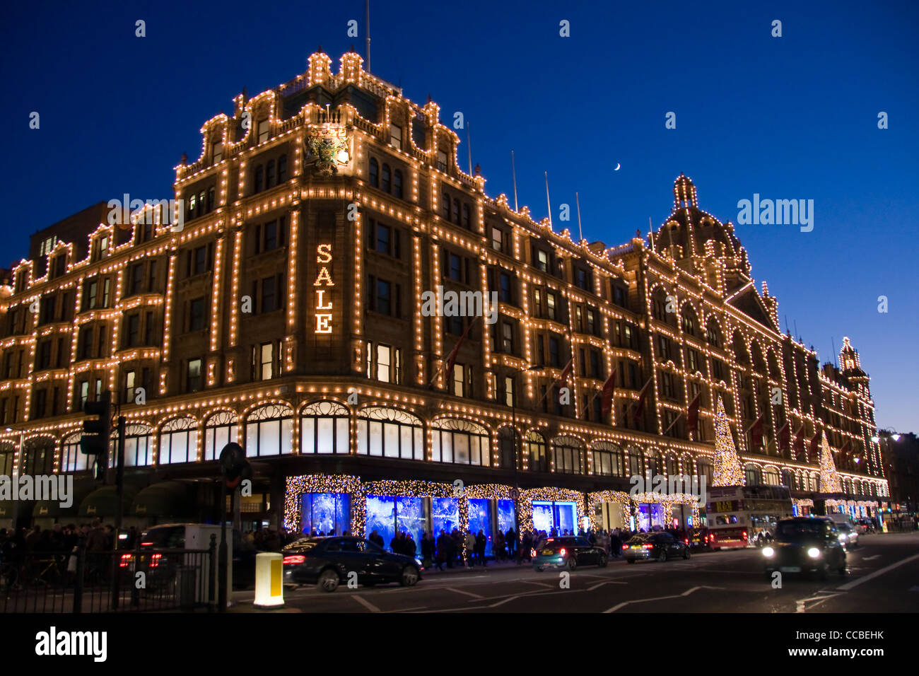 Harrods building by night during winter holiday sales London (UK