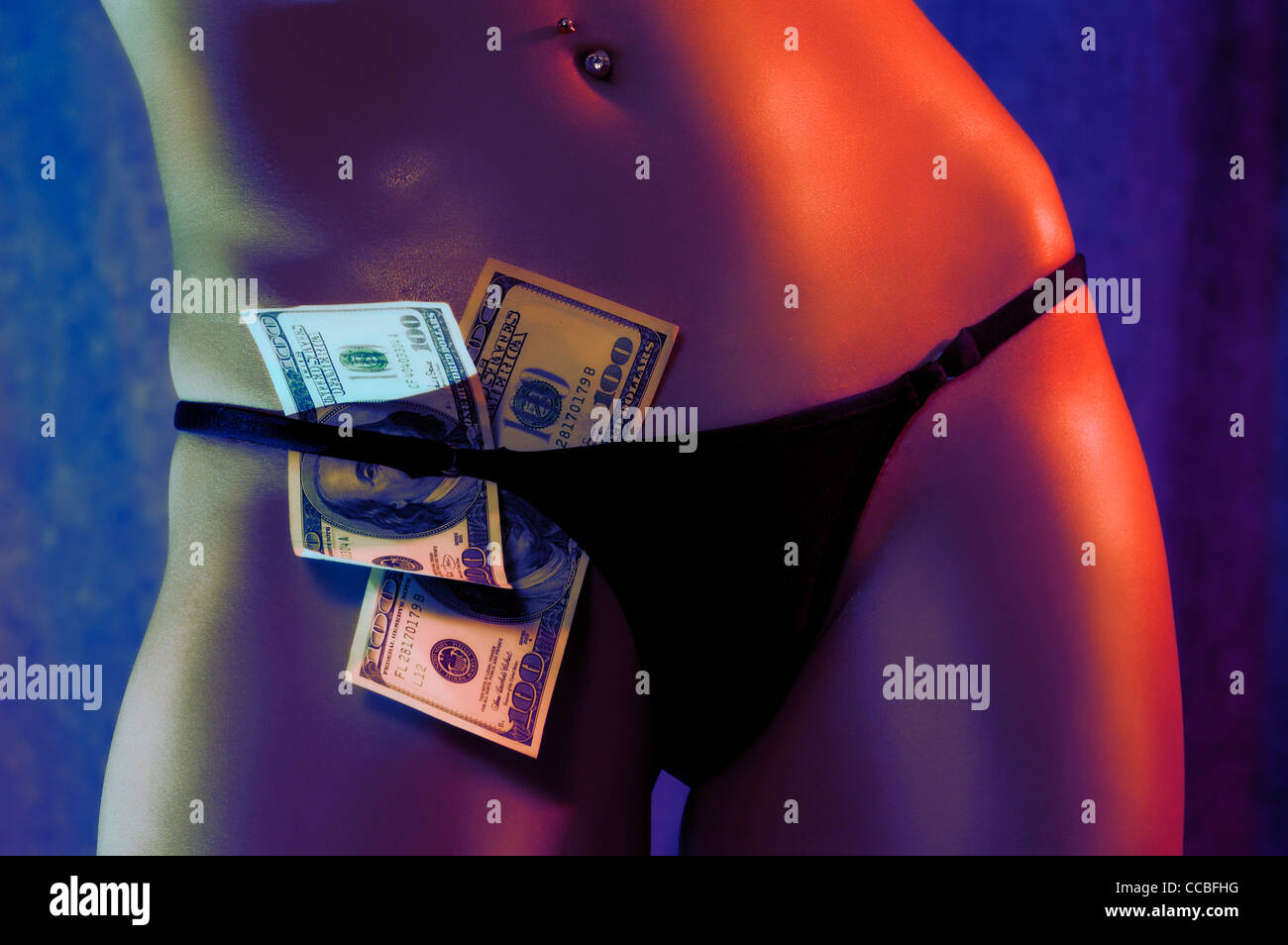 Closeup of a sexy strip club dancer young woman body with hundred dollar  bills tucked in her panties Stock Photo - Alamy