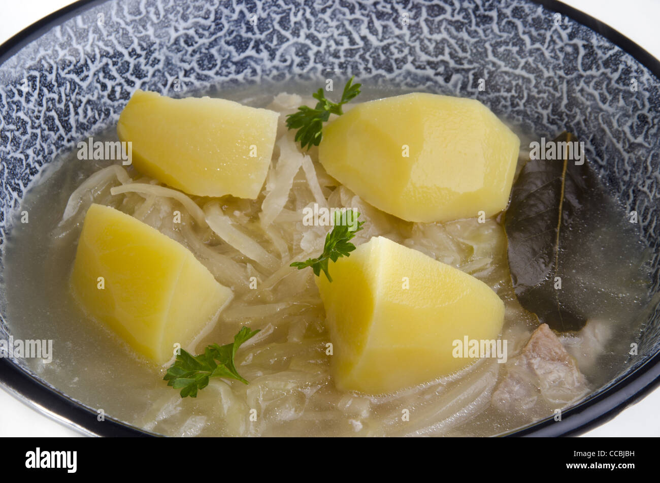 Sauerkraut soup with boiled potatoes Stock Photo