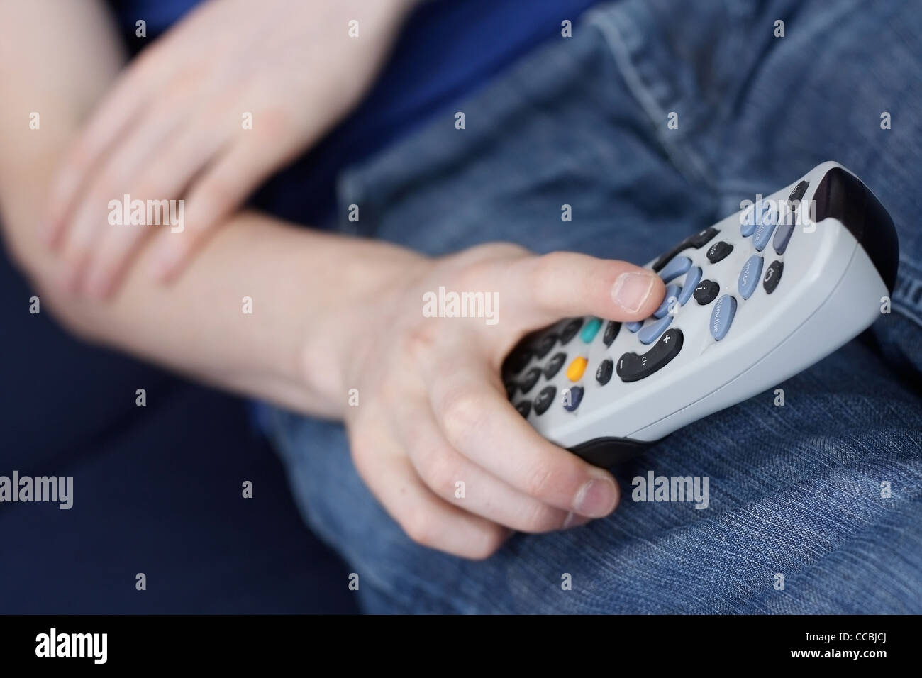 Guy with tv remote Stock Photo - Alamy